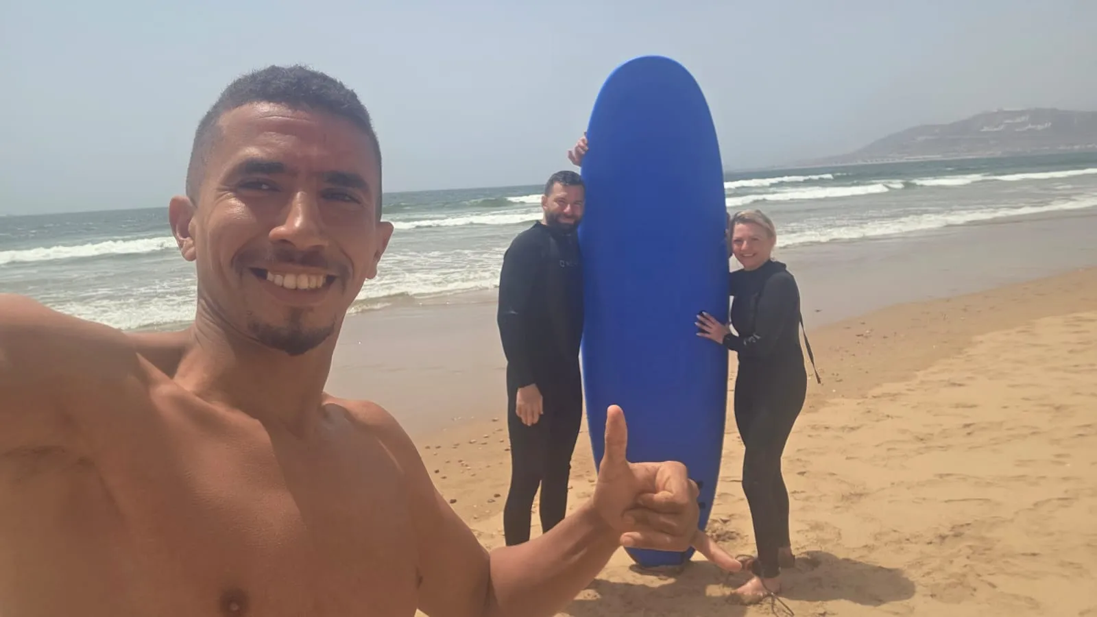 Simo with surf camp guests in the Agadir area — gear and coaching included